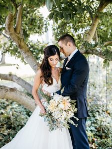 bride-and-groom-holding-bridal-boquet