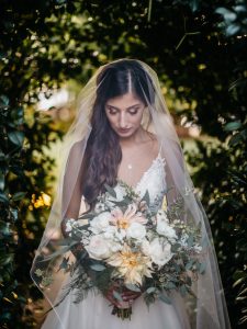 bride-with-veil-holding-boquet