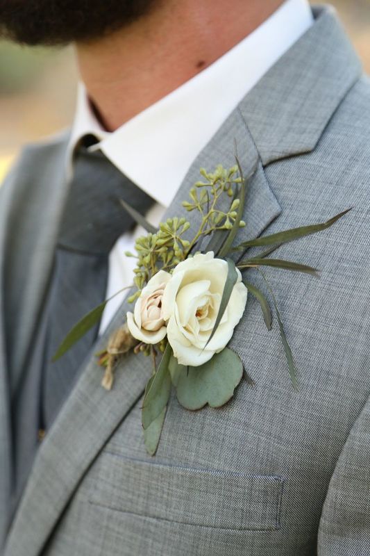 Wedding Flowers: Boutonniere with white spray roses